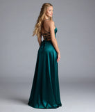 Turn heads at Prom 2025 in this hunter green prom dress, where statement-making details meet the iconic style of the Allegra Lace-Up Slit A-Line Satin Formal Dress.