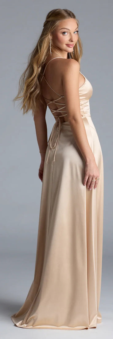 Turn heads at Prom 2025 in this gold prom dress, where statement-making details meet the iconic style of the Allegra Lace-Up Slit A-Line Satin Formal Dress.