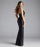 Turn heads at Prom 2025 in this black prom dress, where statement-making details meet the iconic style of the Brookelle Halter Applique Slit Satin Formal Dress.