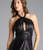 Turn heads at Prom 2025 in this black prom dress, where statement-making details meet the iconic style of the Brookelle Halter Applique Slit Satin Formal Dress.