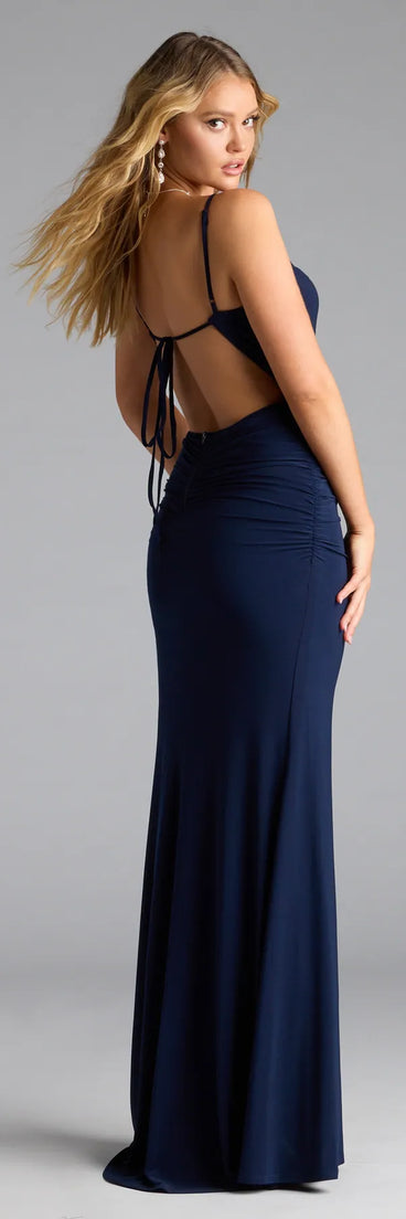 Own the spotlight in the Edna Open Back Mermaid Formal Dress, a navy blue formal dress crafted to deliver luxe style for autumn weddings, Military Balls, or any special event.