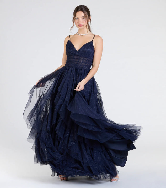 Own the spotlight in the Indiana V-Neck Corset Ruffle A-Line Formal Dress, a navy blue formal dress crafted to deliver luxe style for summer weddings, Army Balls, or any special event.