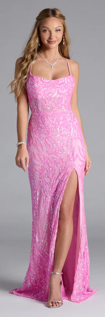 Own the spotlight in the Lani Lace-Up Slit Mermaid Sequin Formal Dress, a pink formal dress crafted to deliver luxe style for autumn weddings, Military Balls, or any special event.