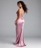 Turn heads at Prom 2025 in this mauve prom dress, where statement-making details meet the iconic style of the Tatianna Lace-Up Applique Slit Satin Formal Dress.