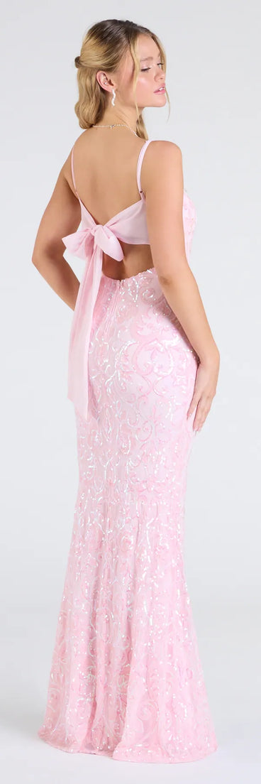 Make a bold statement in the Dana Tie Back Slit Sequin Formal Dress in pink, the perfect summer dress for weddings, cocktail hours, nights out, and/or seasonal celebrations.