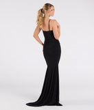 The Corrina Cowl Neck Mermaid Glitter Formal Dress is a show-stopping black prom dress, offering a sleek, slimming silhouette that enhances your natural beauty for an unforgettable night.