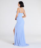 Step into the Prom 2025 dance in the Madison Cowl Neck Slit Glitter Formal Dress, a stunning blue prom dress designed to complement any theme with its timeless allure and statement-making style.