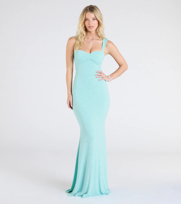 Turn heads at Prom 2025 in this blue prom dress, where statement-making details meet the iconic style of the Halie Open Back Mermaid Glitter Formal Dress.