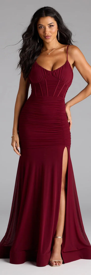 The Cesca Corset Slit Mesh Formal Dress is your new go-to burgundy dress—effortless, versatile, and made to update your fall style in seconds.