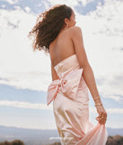 Make a bold statement in the Mackenzie Strapless Corset Bow Satin Formal Dress in pink, the perfect spring dress for weddings, cocktail hours, nights out, and/or seasonal celebrations.
