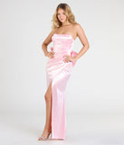Make a bold statement in the Mackenzie Strapless Corset Bow Satin Formal Dress in pink, the perfect spring dress for weddings, cocktail hours, nights out, and/or seasonal celebrations.