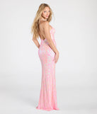 Turn heads at Prom 2025 in this pink prom dress, where statement-making details meet the iconic style of the Kensley Open Back Slit Sequin Formal Dress.