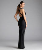 Turn heads at Prom 2025 in this black prom dress, where statement-making details meet the iconic style of the Jenn V-Neck Strappy Back Slit Long Formal Dress.
