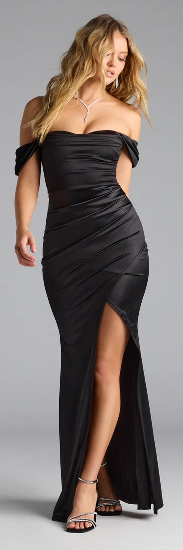 Feel instantly put-together in the Belinda Off-The-Shoulder Slit Satin Formal Dress in black, a stylish wedding guest dress designed for confident style and all-out celebration.