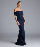 Turn heads at Prom 2025 in this navy blue prom dress, where statement-making details meet the iconic style of the Nastassia Off-The-Shoulder Mermaid Glitter Formal Dress.