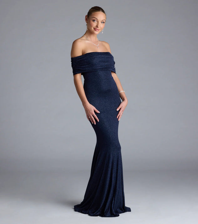 Turn heads at Prom 2025 in this navy blue prom dress, where statement-making details meet the iconic style of the Nastassia Off-The-Shoulder Mermaid Glitter Formal Dress.