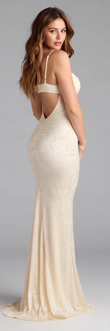Own the spotlight in the Haisley Open Back Floral Lace Mermaid Dress, a ivory formal dress crafted to deliver luxe style for winter weddings, Military Balls, or any special event.