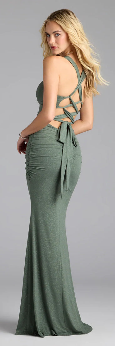 Own the spotlight in the Tatiana Lace-Up Mermaid Glitter Formal Dress, a olive green formal dress crafted to deliver luxe style for nighttime weddings, Military Balls, or any special event.