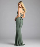 Own the spotlight in the Tatiana Lace-Up Mermaid Glitter Formal Dress, a olive green formal dress crafted to deliver luxe style for summer weddings, Army Balls, or any special event.