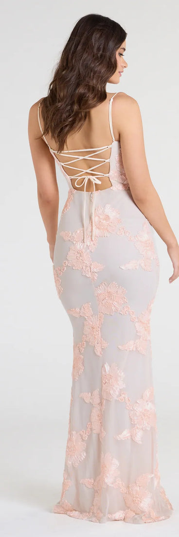 Turn heads at Prom 2025 in this blush prom dress, where statement-making details meet the iconic style of the Nicollet Lace-Up Mermaid Floral Formal Dress.