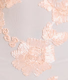 Turn heads at Prom 2025 in this blush prom dress, where statement-making details meet the iconic style of the Nicollet Lace-Up Mermaid Floral Formal Dress.