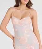 Turn heads at Prom 2025 in this blush prom dress, where statement-making details meet the iconic style of the Nicollet Lace-Up Mermaid Floral Formal Dress.