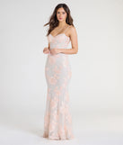Turn heads at Prom 2025 in this blush prom dress, where statement-making details meet the iconic style of the Nicollet Lace-Up Mermaid Floral Formal Dress.