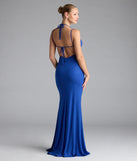 Turn heads at Prom 2025 in this royal blue prom dress, where statement-making details meet the iconic style of the Ariadna Strappy Open Back Slit Glitter Formal Dress.
