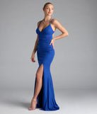 Turn heads at Prom 2025 in this royal blue prom dress, where statement-making details meet the iconic style of the Ariadna Strappy Open Back Slit Glitter Formal Dress.