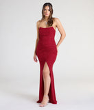 Turn heads at Prom 2025 in this red prom dress, where statement-making details meet the iconic style of the Perry Glitter Knit Wrap Slit Mermaid Dress.