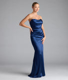 Turn heads at Prom 2025 in this navy blue prom dress, where statement-making details meet the iconic style of the Colette Strapless Mermaid Satin Formal Dress.