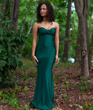 Turn heads at Prom 2025 in this hunter green prom dress, where statement-making details meet the iconic style of the Kimberly Strapless Tie-Back Mermaid Formal Dress.