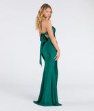 The Kimberly Strapless Tie-Back Mermaid Formal Dress in hunter is a stunning green prom dress designed to capture attention with its fresh or bold color and effortlessly stylish silhouette.