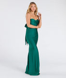 The Kimberly Strapless Tie-Back Mermaid Formal Dress in hunter is a stunning green prom dress designed to capture attention with its fresh or bold color and effortlessly stylish silhouette.