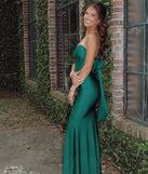 Turn heads at Prom 2025 in this hunter green prom dress, where statement-making details meet the iconic style of the Kimberly Strapless Tie-Back Mermaid Formal Dress.