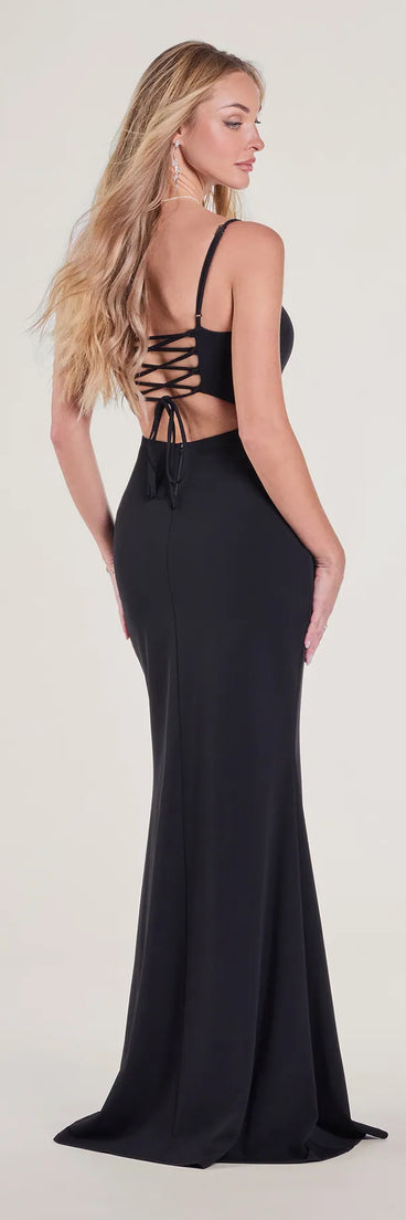The Hailey Lace-Up Slit Slim Crepe Formal Dress is a show-stopping black prom dress, offering a sleek, slimming silhouette that enhances your natural beauty for an unforgettable night.