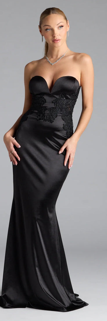 Keep it classic with the Amari Strapless Applique Mermaid Satin Formal Dress, a feed-worthy pick from Windsor's black homecoming dress collection made to stop their scroll from pictures to the dance floor.