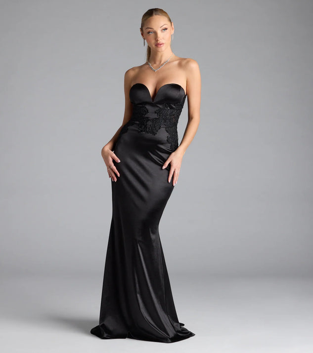 Turn heads at Prom 2025 in this black prom dress, where statement-making details meet the iconic style of the Amari Strapless Applique Mermaid Satin Formal Dress.