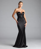 Turn heads at Prom 2025 in this black prom dress, where statement-making details meet the iconic style of the Amari Strapless Applique Mermaid Satin Formal Dress.