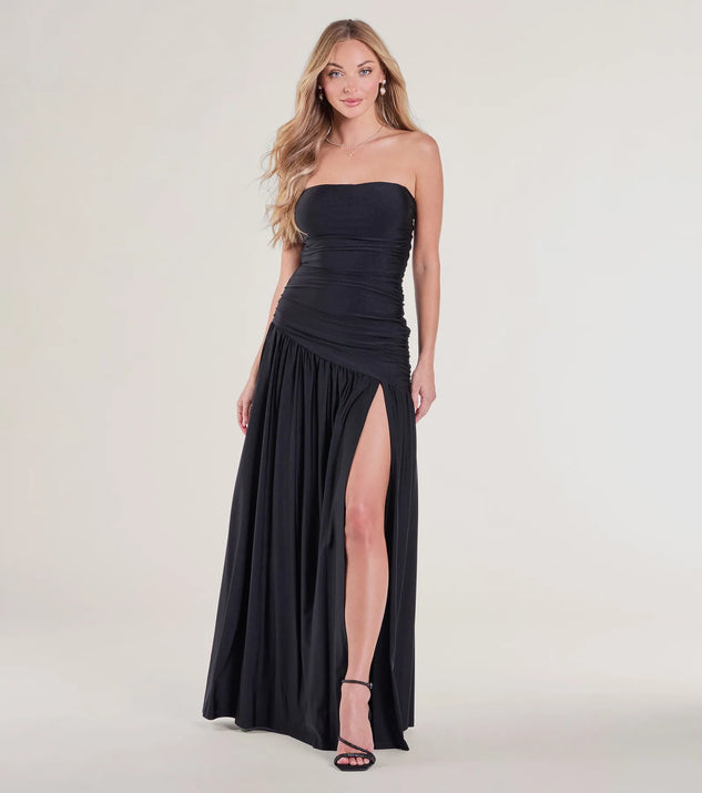 The Lindsey Strapless Slit A-Line Formal Dress in luxe black fabric, a stunning prom dress with statement details designed to make a bold impression at Prom 2025.