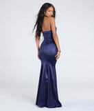 Step into the Prom 2025 dance in the Charlie Halter Keyhole Mermaid Satin Formal Dress in navy, a stunning blue prom dress designed to complement any theme with its timeless allure and statement-making style.
