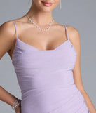Turn heads at Prom 2025 in this lavender prom dress, where statement-making details meet the iconic style of the Madison Cowl Neck Slit Glitter Formal Dress.