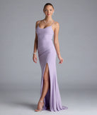 Turn heads at Prom 2025 in this lavender prom dress, where statement-making details meet the iconic style of the Madison Cowl Neck Slit Glitter Formal Dress.
