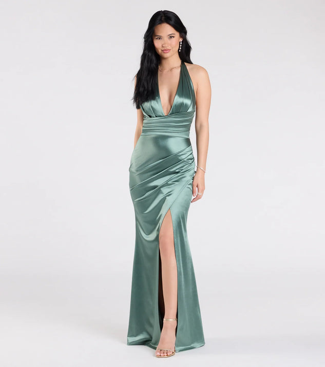 The Joanne Halter Slit Mermaid Satin Formal Dress in sage is a stunning green prom dress designed to capture attention with its fresh or bold color and effortlessly stylish silhouette.