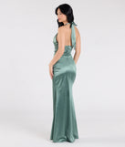 The Joanne Halter Slit Mermaid Satin Formal Dress in sage is a stunning green prom dress designed to capture attention with its fresh or bold color and effortlessly stylish silhouette.