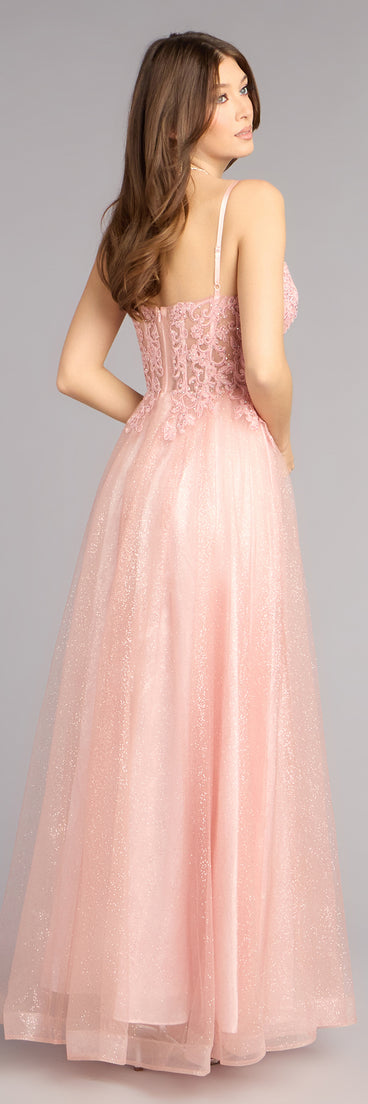 This pink prom dress, the Lexi Glitter Corset A-Line Ball Gown , features a sleek, floor-length design with trend-forward details that capture the excitement of Prom 2026.