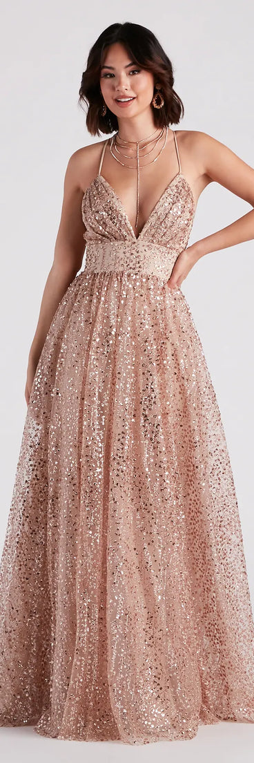 The Stacy Glitter Sequin Tulle Ball Gown is a shimmery gold glitter dress that catches the light beautifully, perfect for any special outfit like spring formal attire, clubwear, or a wedding guest dress.