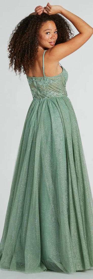 The Tia Sweetheart Lace Applique A-Line Ball Gown in sage is a stunning green prom dress designed to capture attention with its fresh or bold color and effortlessly stylish silhouette.