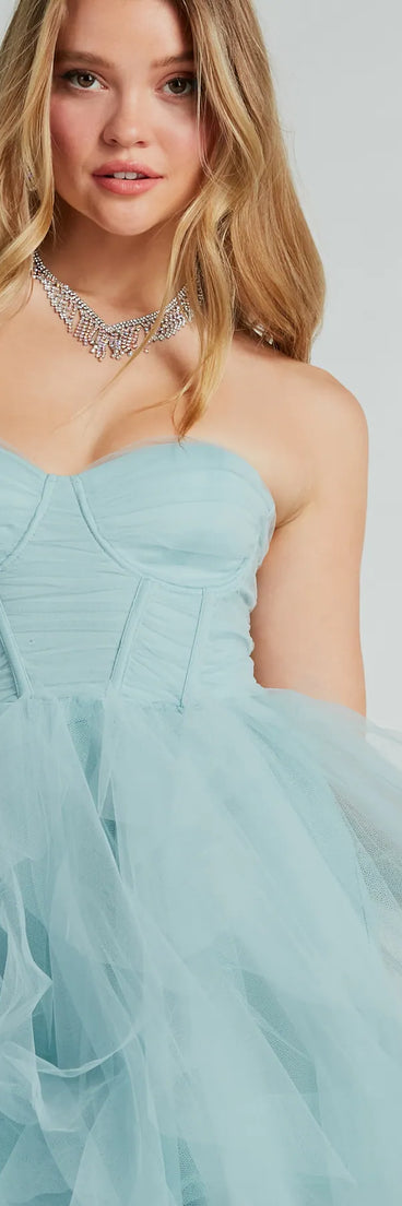 Own the spotlight in the Lindsey Bustier A-Line Ruffle Tulle Ball Gown, a light blue formal dress crafted to deliver luxe style for summer weddings, Army Balls, or any special event.