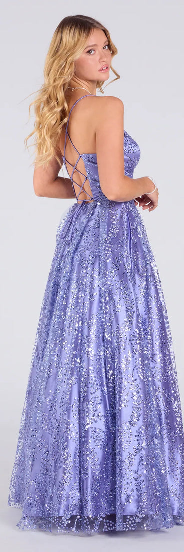 Make a bold statement in the Elsie Glitter Tulle Lace-Up Ball Gown in periwinkle, the perfect spring dress for weddings, cocktail hours, nights out, and/or seasonal celebrations.
